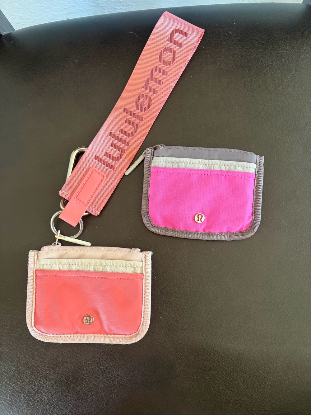 lululemon athletica coral and hot pink wristlet set with branded strap